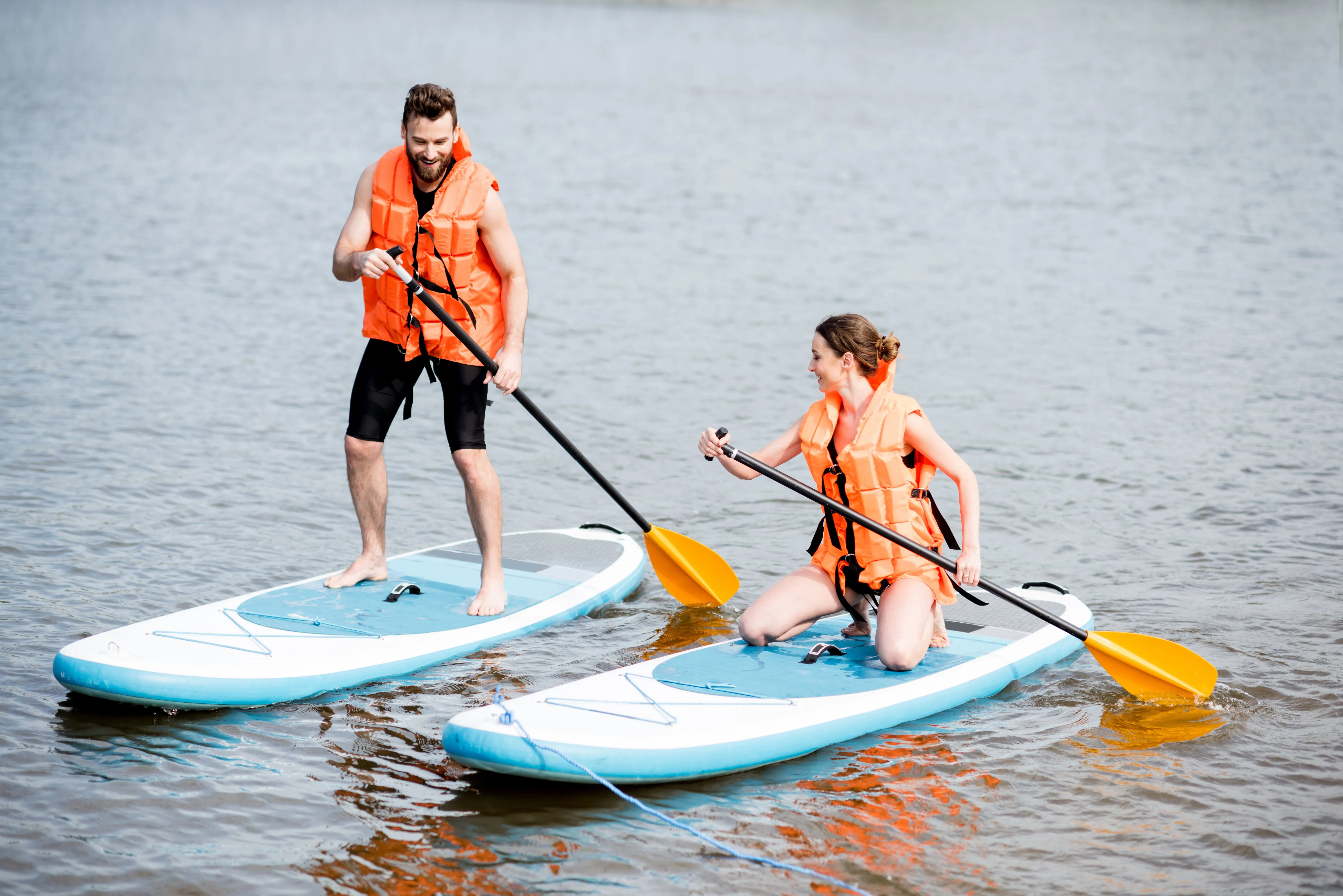 Couple Rowing On The Stand Up Paddleboard 2021 12 09 17 41 10 Utc